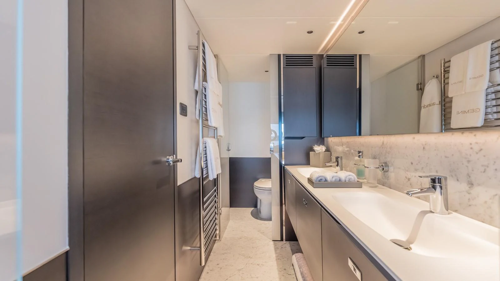 a bathroom with a sink and a mirror aboard GEMINI Yacht for Sale