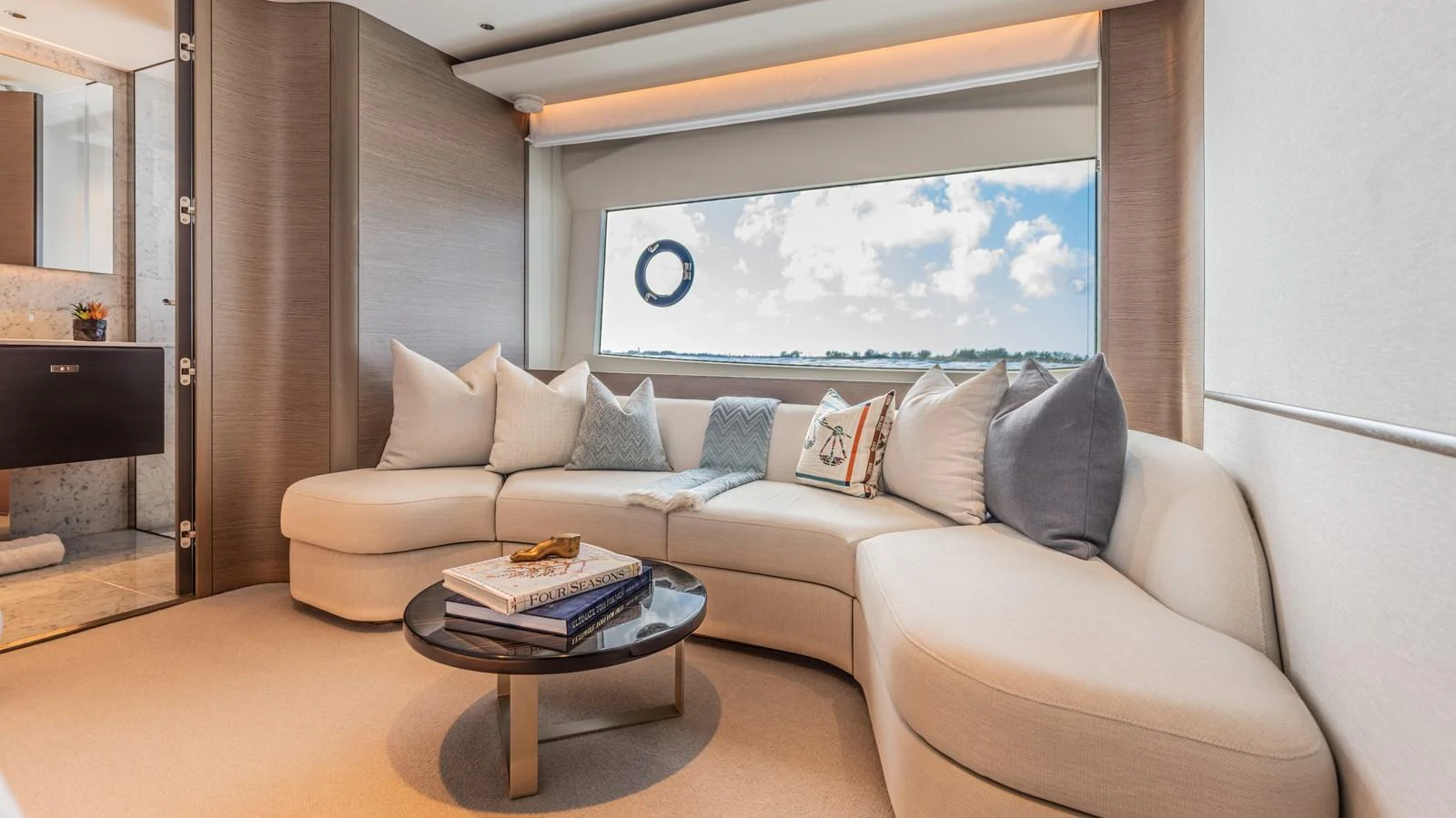 a living room with a couch and a table aboard GEMINI Yacht for Sale
