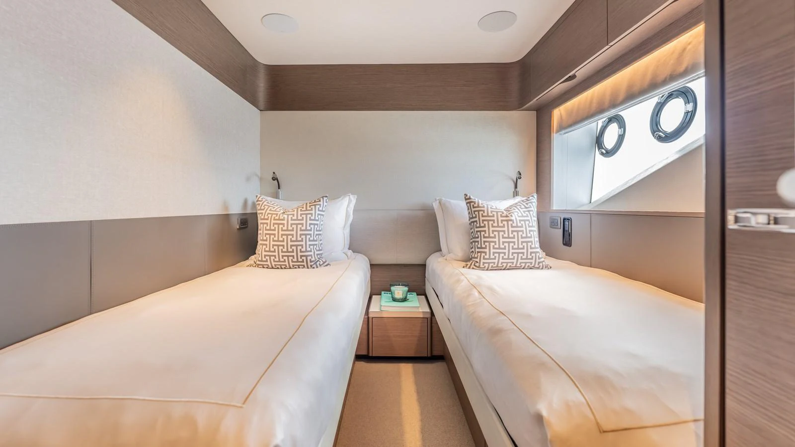 a room with two beds aboard GEMINI Yacht for Sale