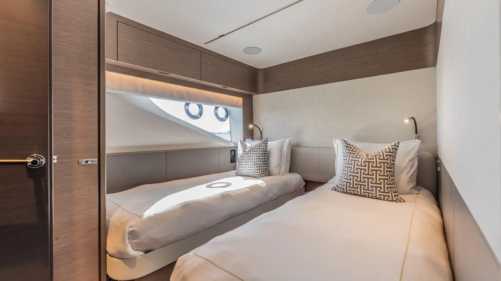 a room with two beds aboard GEMINI Yacht for Sale