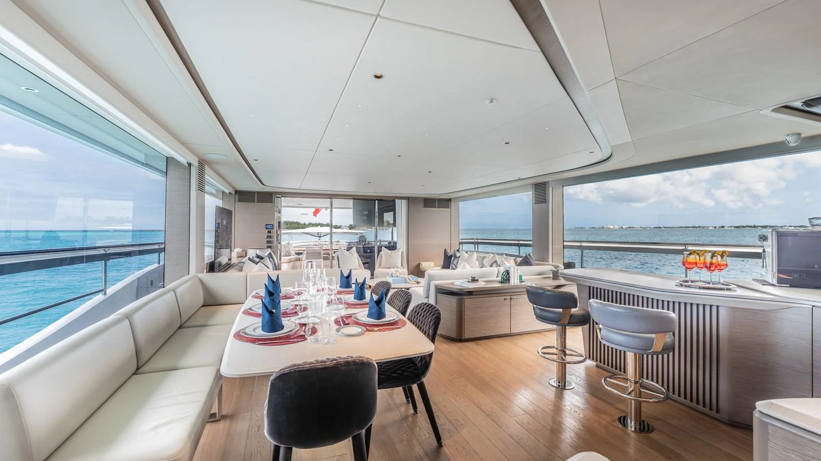 a large modern kitchen with a large window overlooking the ocean aboard GEMINI Yacht for Sale