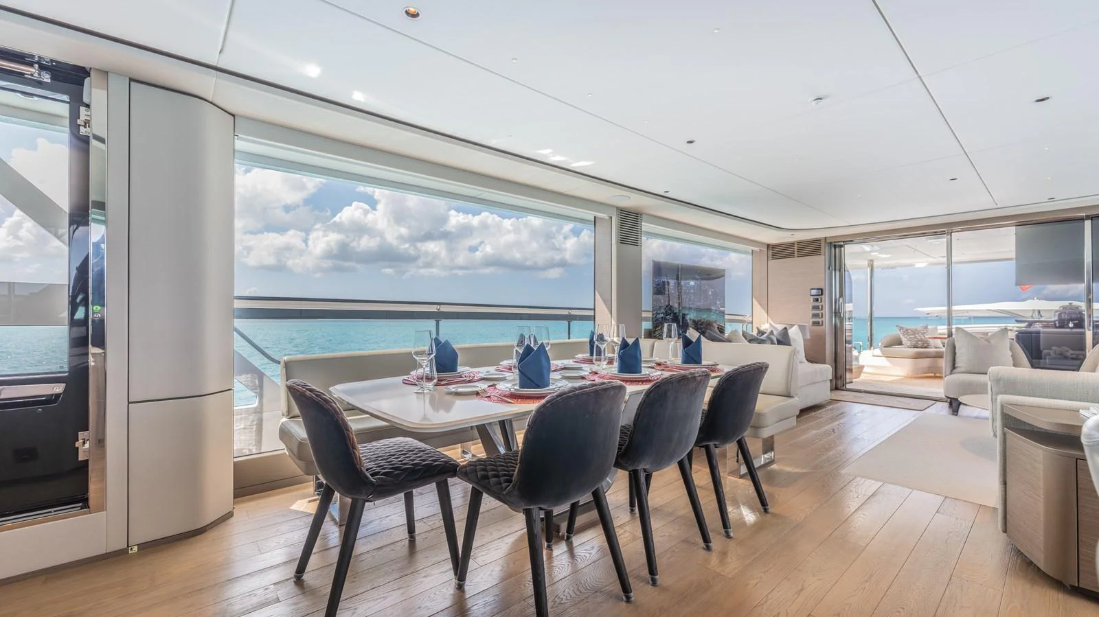 a large room with a table and chairs aboard GEMINI Yacht for Sale