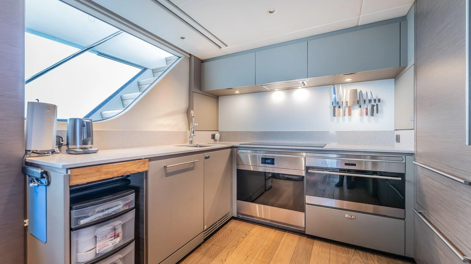 a kitchen with stainless steel appliances aboard GEMINI Yacht for Sale