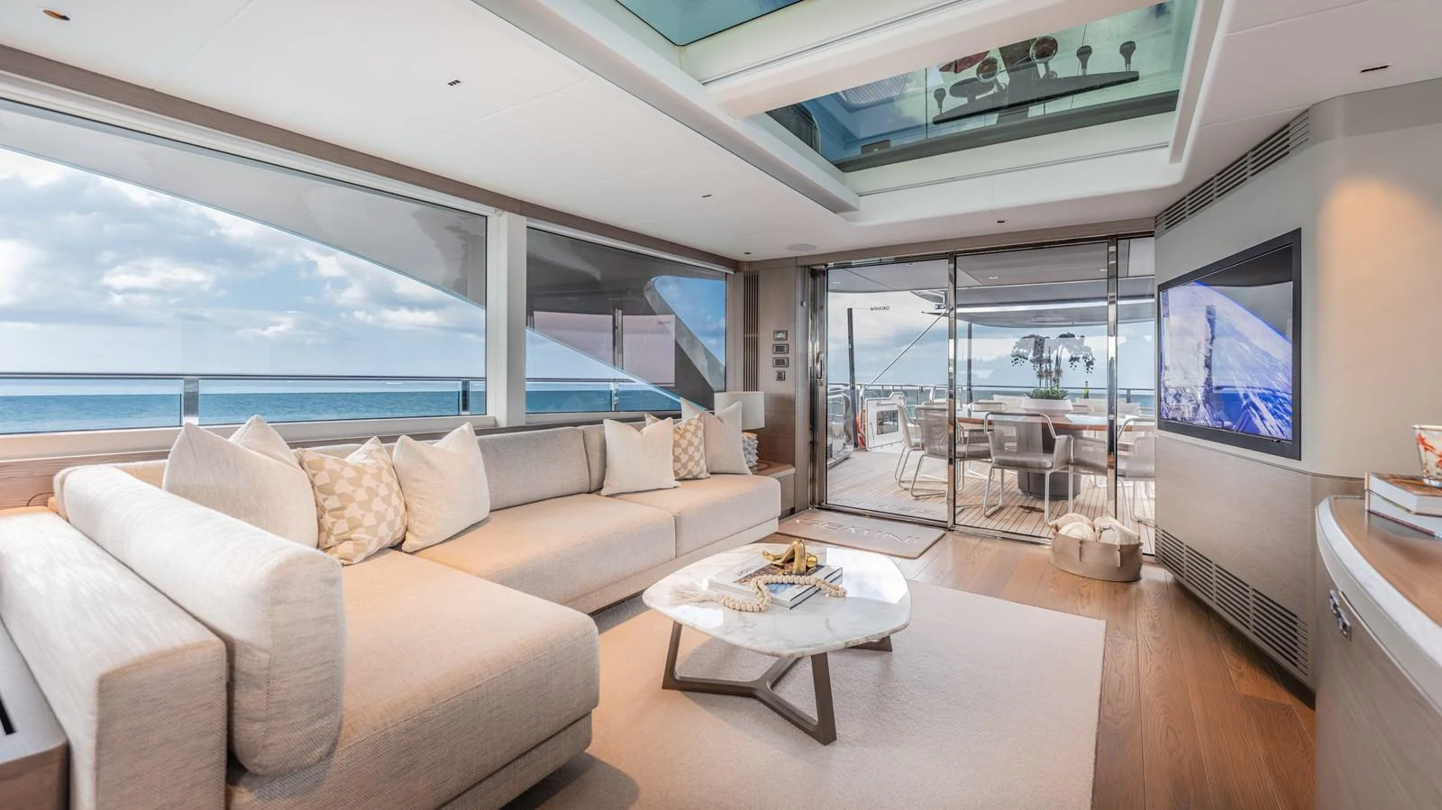 a living room with a large window aboard GEMINI Yacht for Sale
