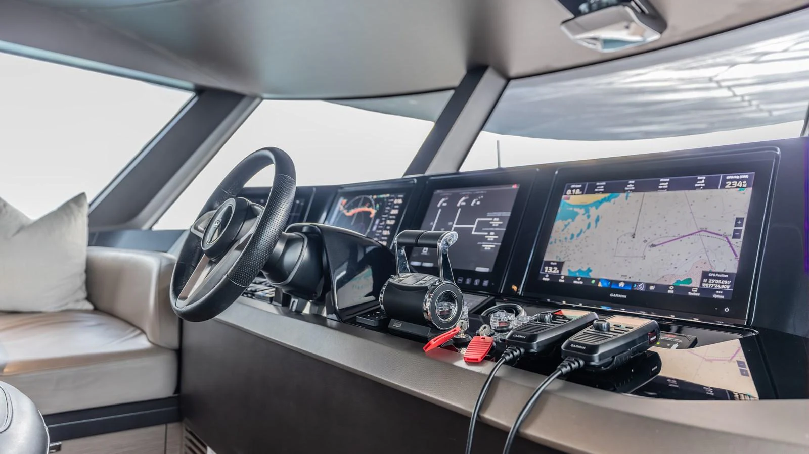 a car with a screen and a couple of electronic devices on it aboard GEMINI Yacht for Sale