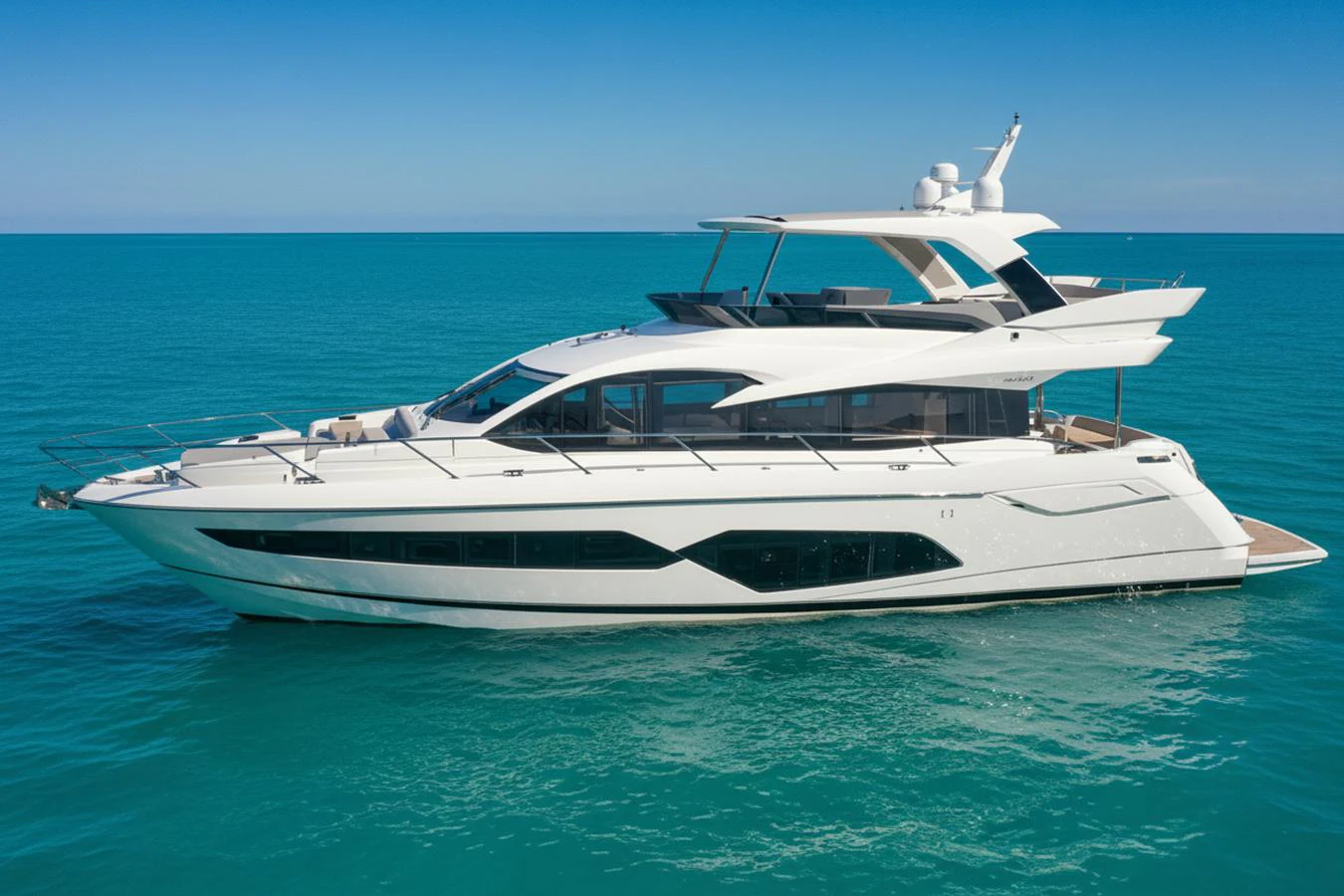 A sleek and modern yacht cruising on calm turquoise waters under a clear blue sky. aboard SMITTEN Yacht for Sale