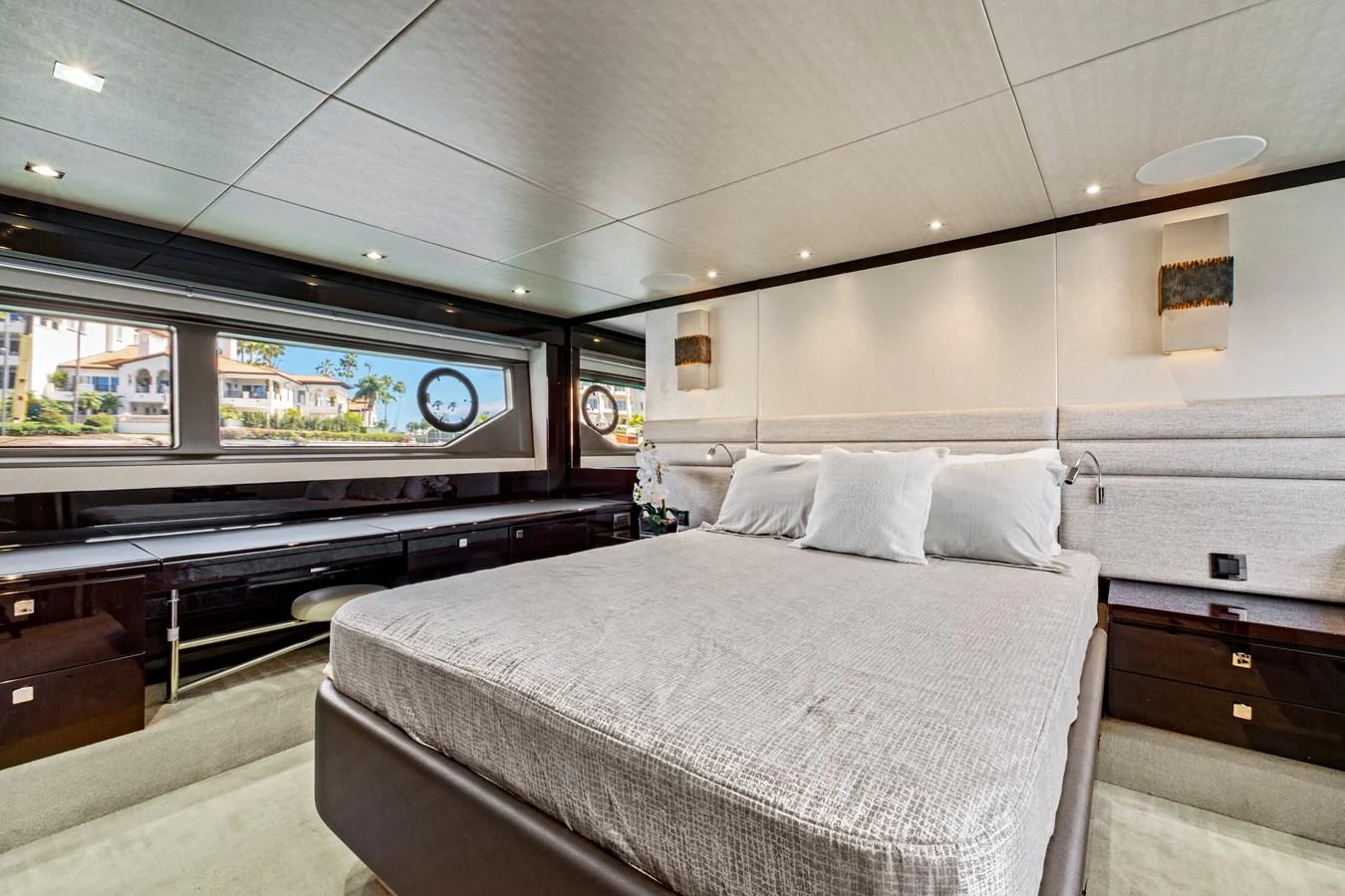 The master stateroom offers a spacious and luxurious retreat with elegant furnishings and ample natural light. aboard SMITTEN Yacht for Sale