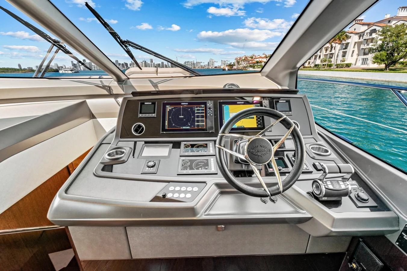 The helm station offers a sophisticated and modern control center with advanced navigation equipment and a stunning view. aboard SMITTEN Yacht for Sale