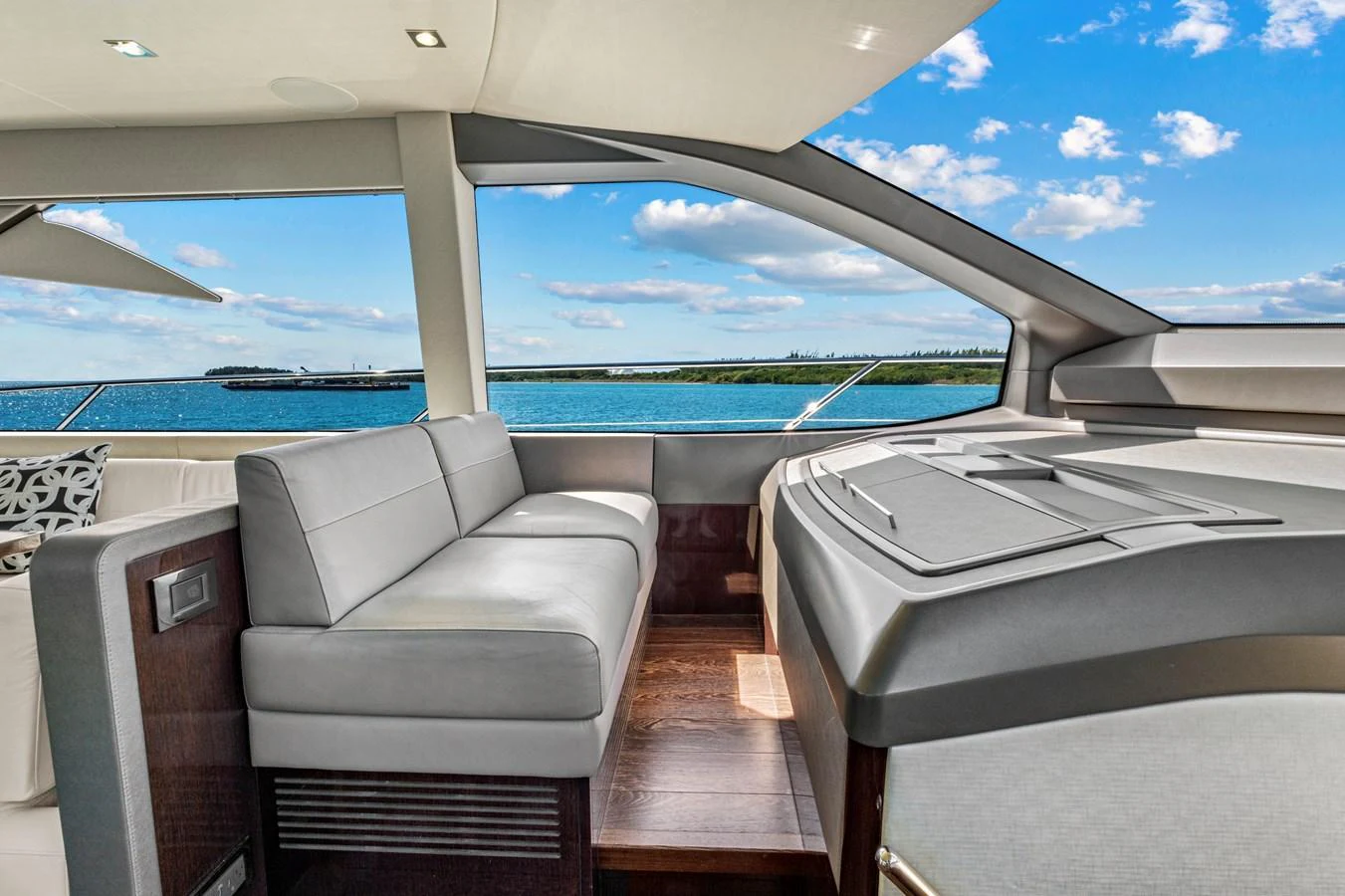 The salon offers a spacious and modern seating area with panoramic views of the sea. aboard SMITTEN Yacht for Sale