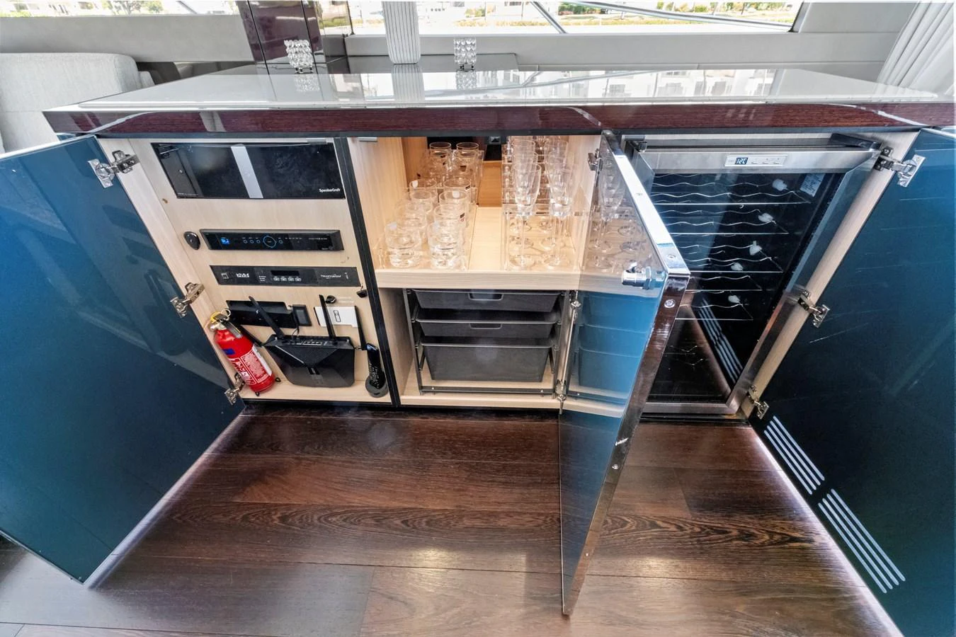 The galley features modern appliances and ample storage for glassware and other essentials. aboard SMITTEN Yacht for Sale