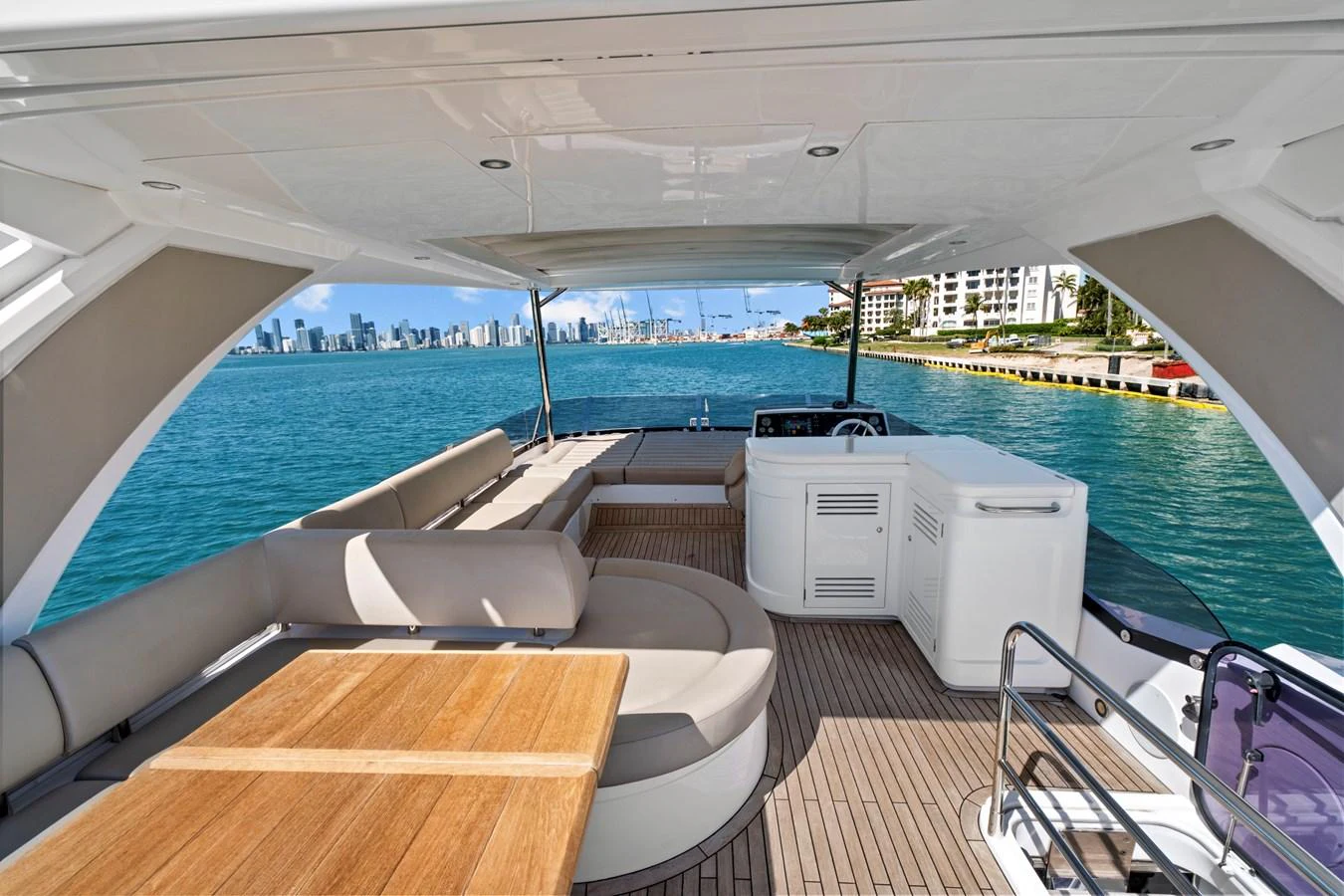 The aft deck offers a spacious and comfortable seating area with a stunning view of the water. aboard SMITTEN Yacht for Sale