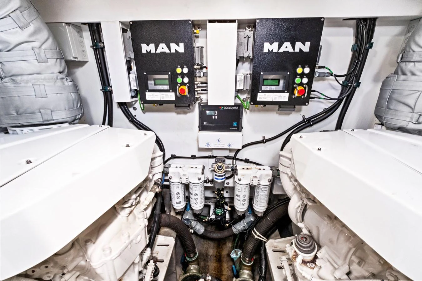 The engine room showcases advanced machinery and well-organized systems. aboard SMITTEN Yacht for Sale