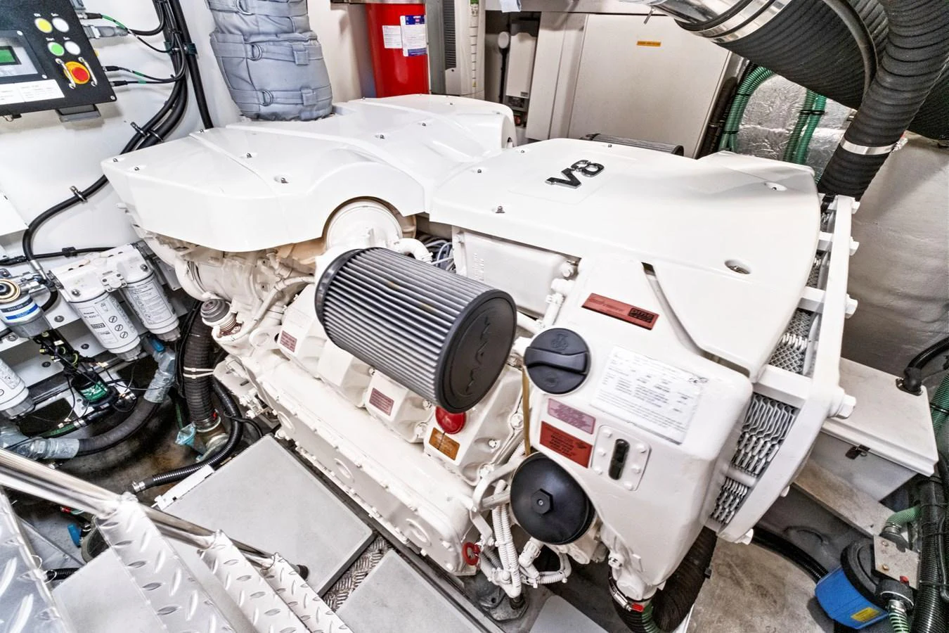 The image showcases the pristine engine room with a powerful V8 engine. aboard SMITTEN Yacht for Sale