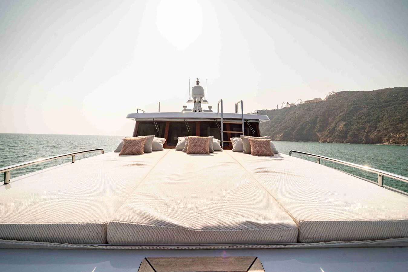 The yacht's foredeck features a spacious sunbathing area with plush cushions, perfect for relaxation. aboard VERO Yacht for Sale