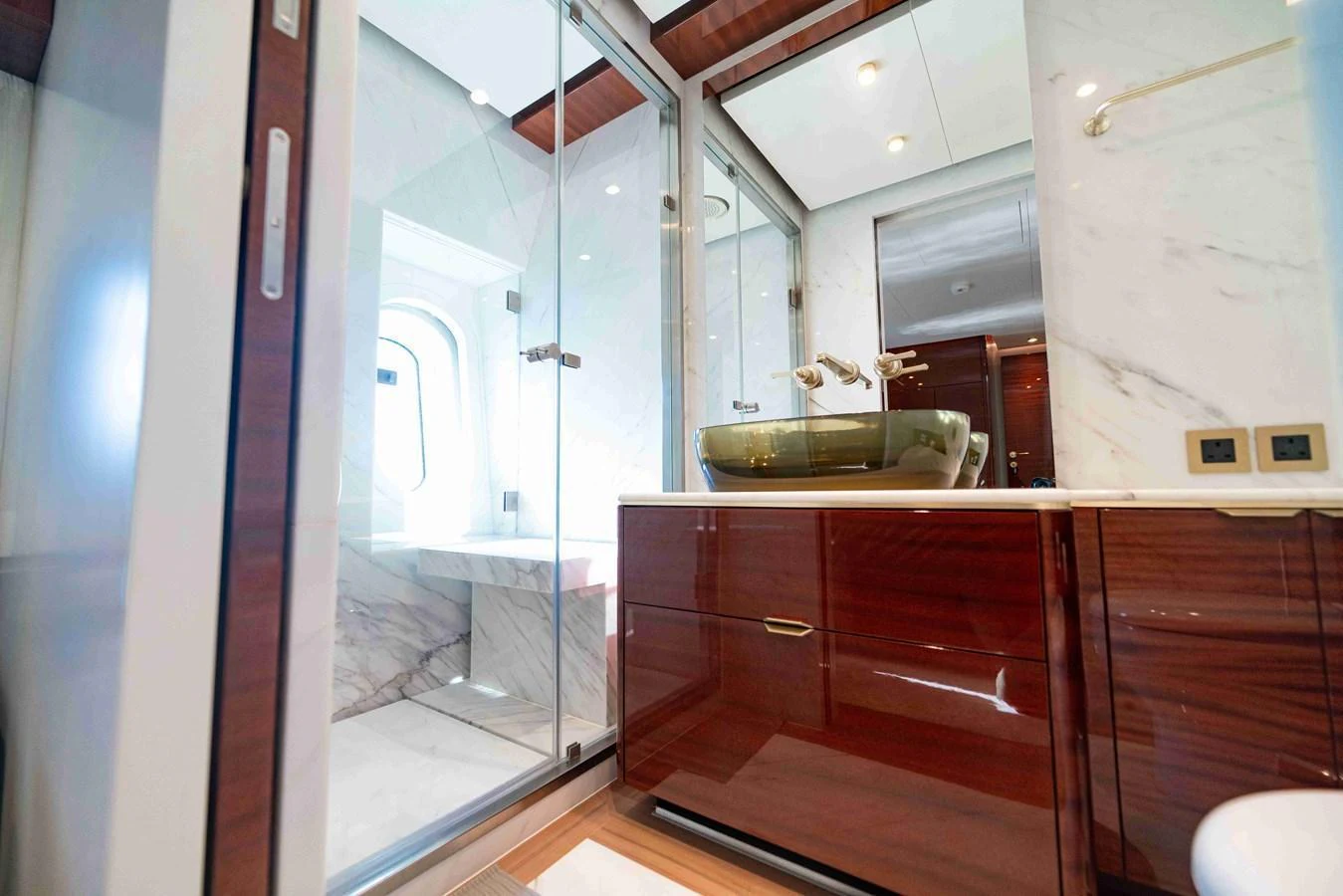 The yacht's bathroom features luxurious finishes and a spacious shower area. aboard VERO Yacht for Sale