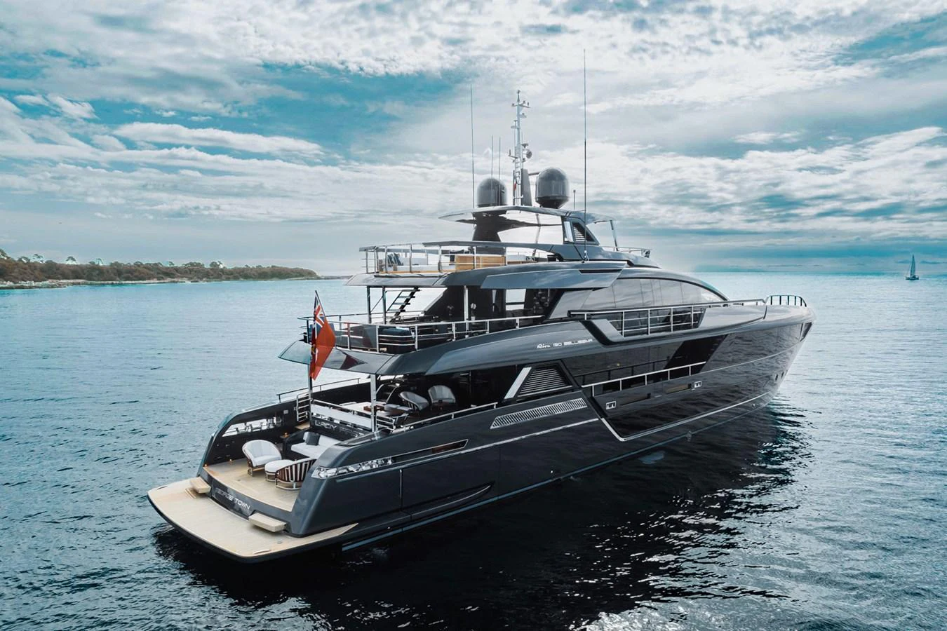 A sleek and modern yacht glides gracefully on calm waters under a partly cloudy sky. aboard LADY FIRST Yacht for Sale