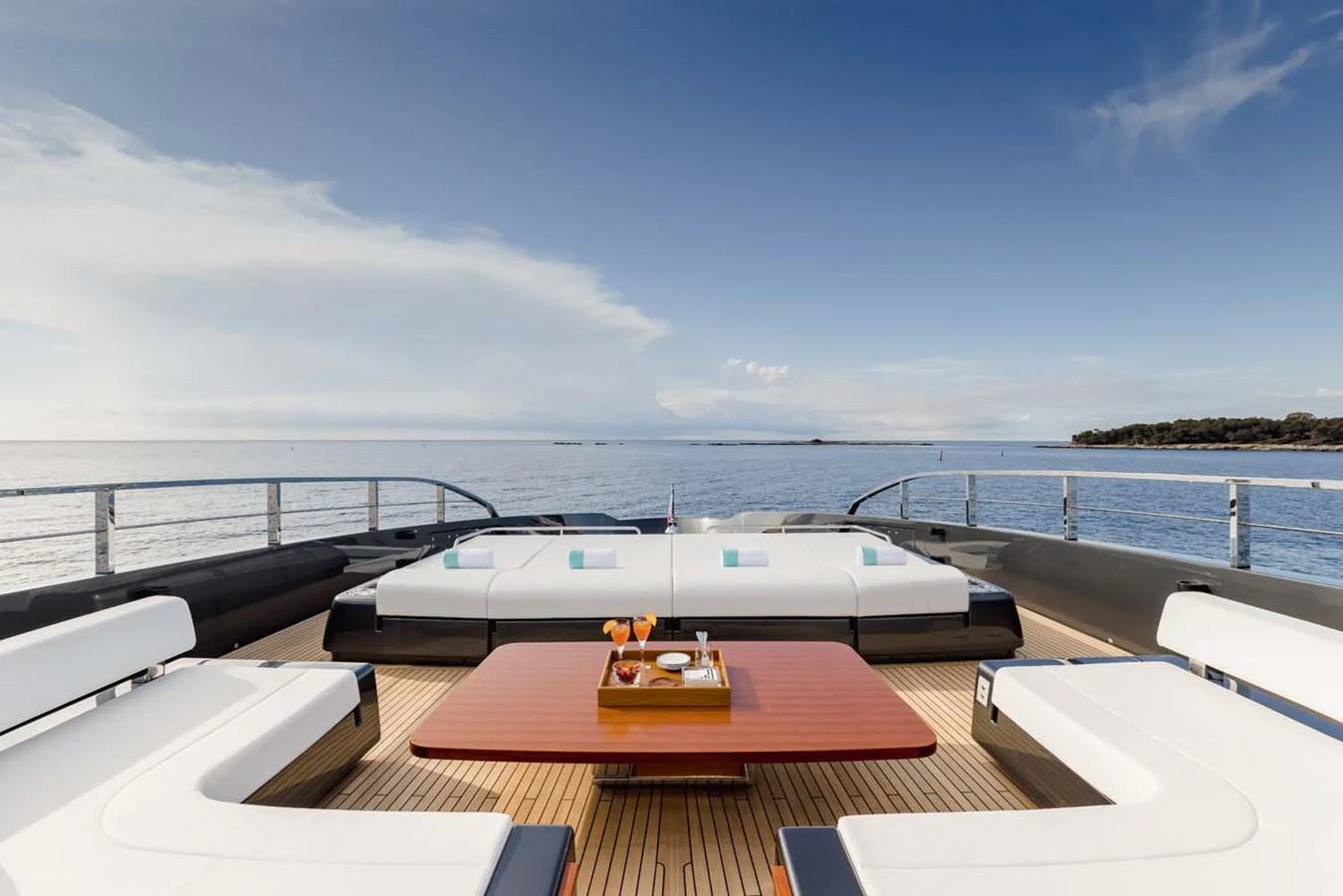 The sundeck offers a luxurious lounging area with panoramic ocean views. aboard LADY FIRST Yacht for Sale