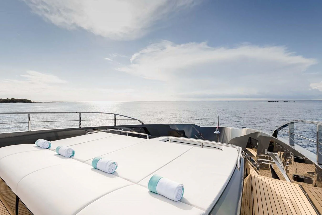 The sundeck offers a serene space with plush sunbeds and a stunning ocean view. aboard LADY FIRST Yacht for Sale