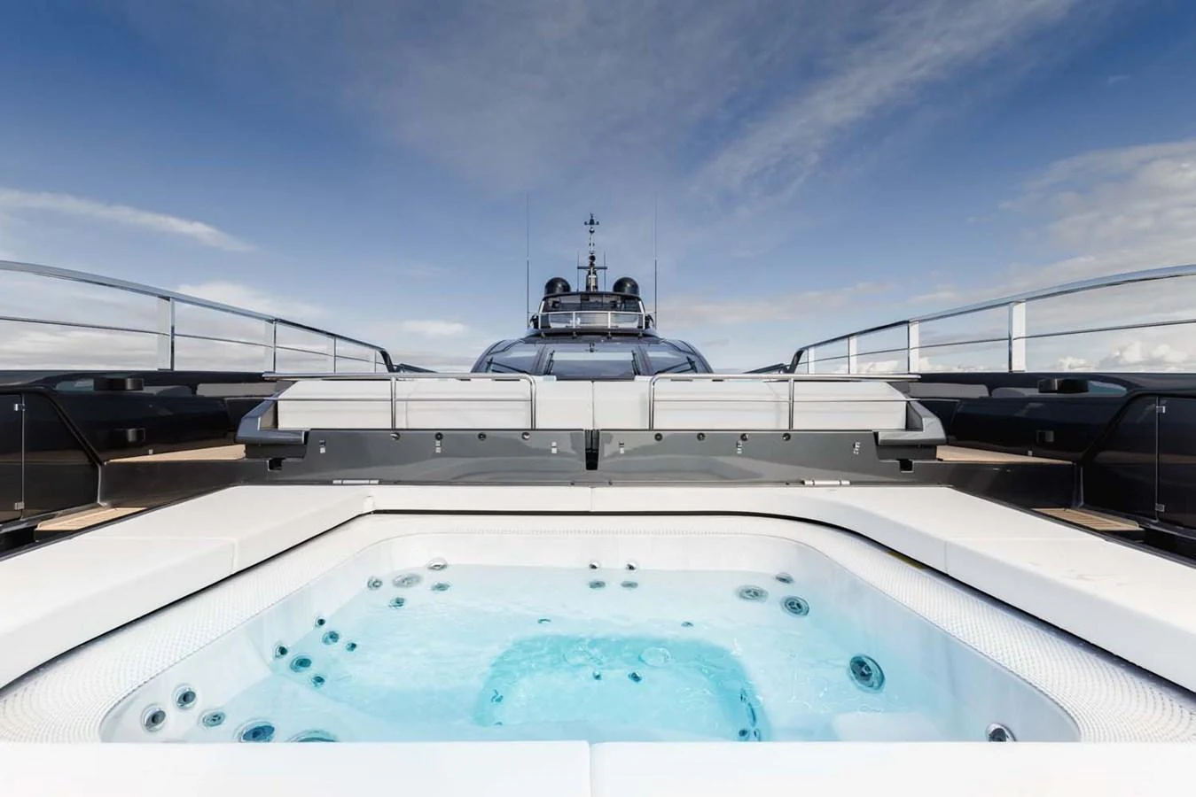 The yacht's sundeck features a luxurious jacuzzi with stunning views. aboard LADY FIRST Yacht for Sale