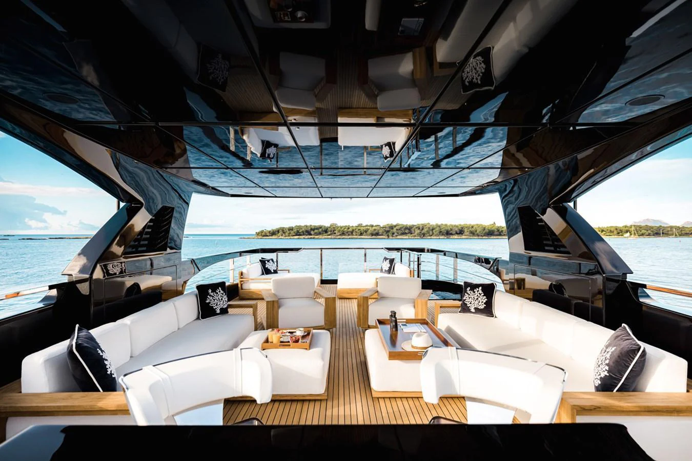 The aft deck features a spacious and luxurious seating area with stunning views of the water. aboard LADY FIRST Yacht for Sale
