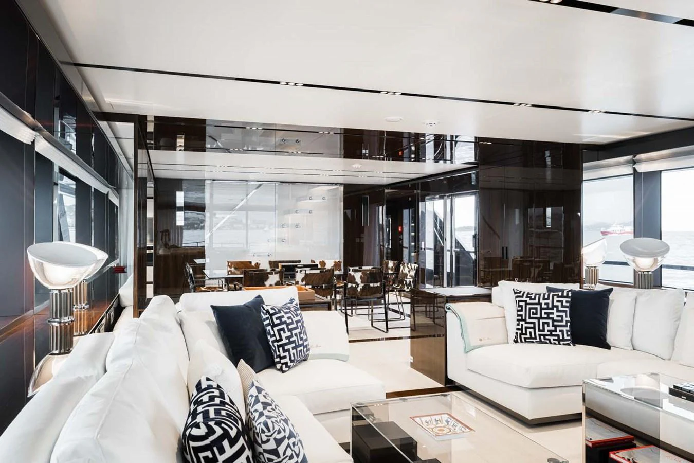 The yacht's salon features luxurious seating with modern decor and ample natural light. aboard LADY FIRST Yacht for Sale