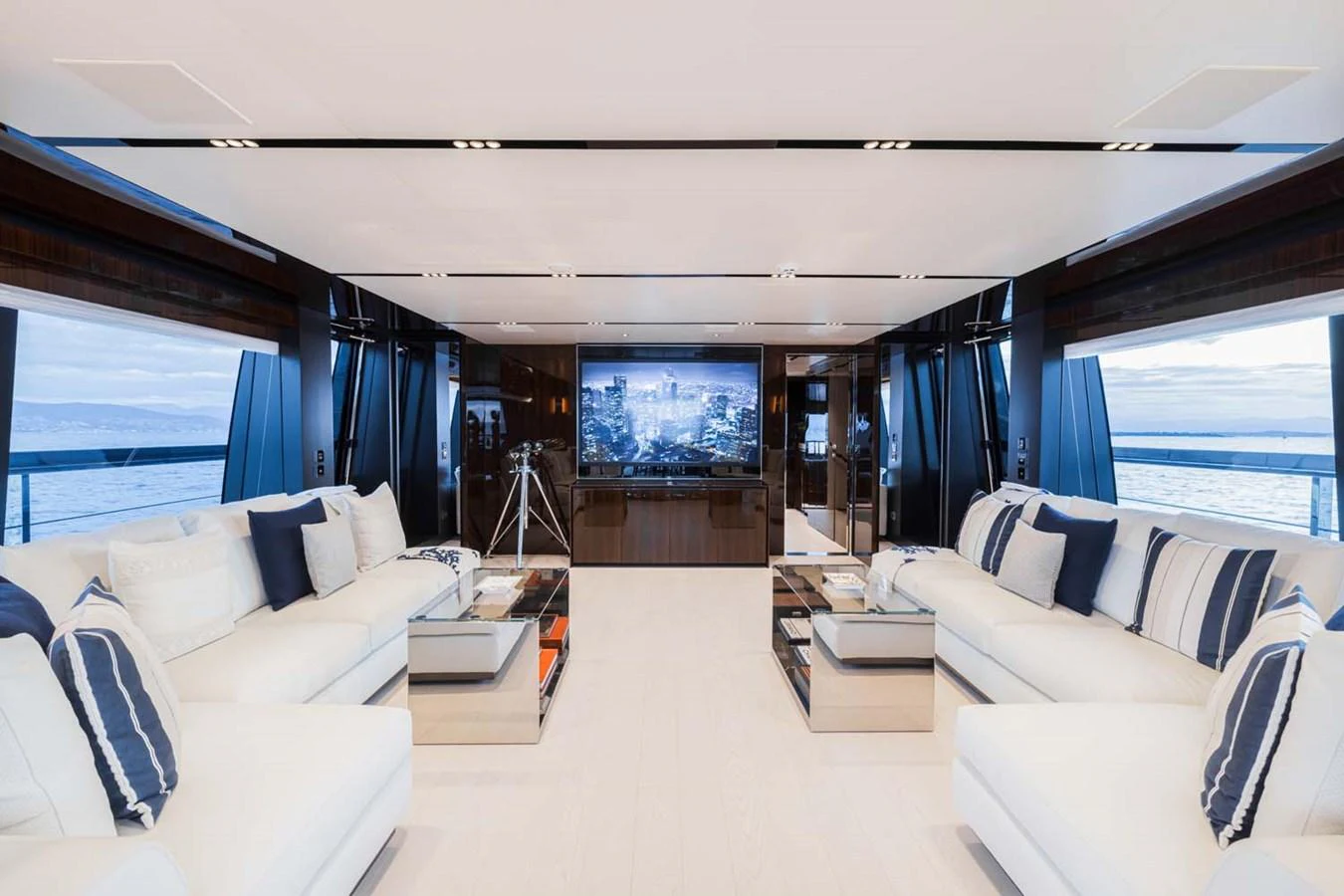 The salon offers a spacious and luxurious seating area with panoramic views and modern entertainment amenities. aboard LADY FIRST Yacht for Sale