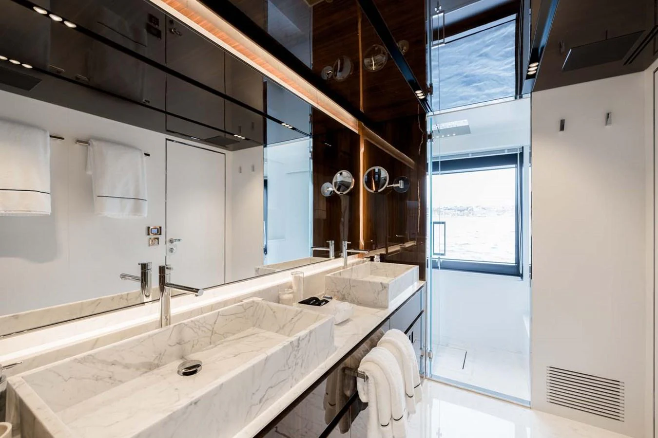 The yacht's bathroom features a sleek design with marble countertops and modern fixtures. aboard LADY FIRST Yacht for Sale