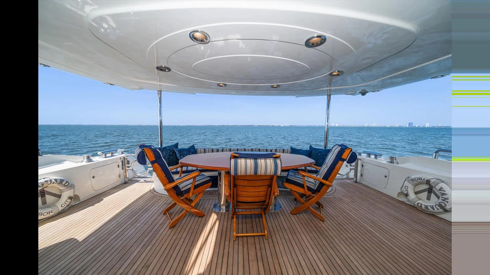 The aft deck offers a spacious and inviting area for alfresco dining with stunning sea views. aboard VANGUARD Yacht for Sale