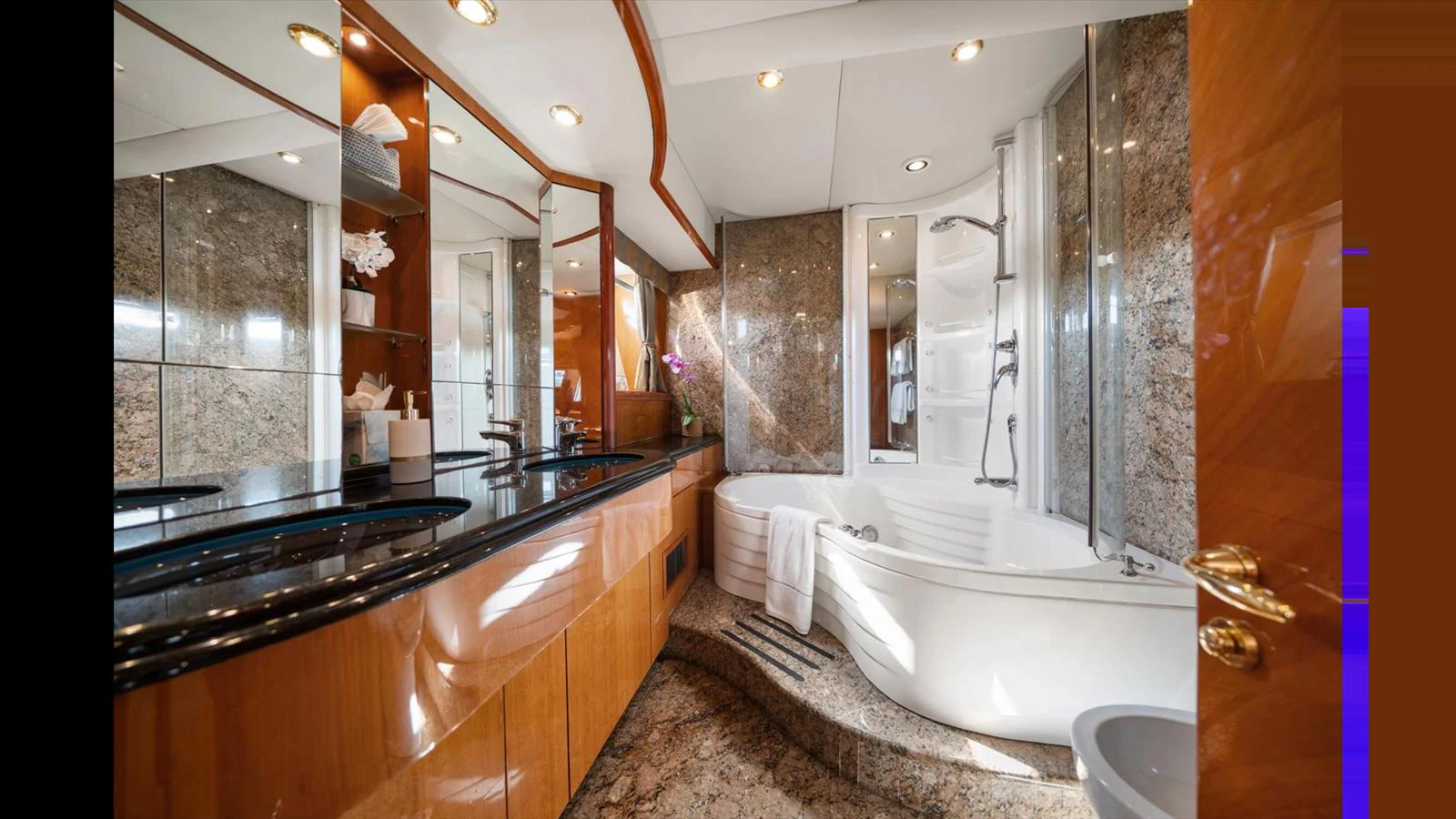 The yacht's bathroom features luxurious fixtures and elegant design. aboard VANGUARD Yacht for Sale