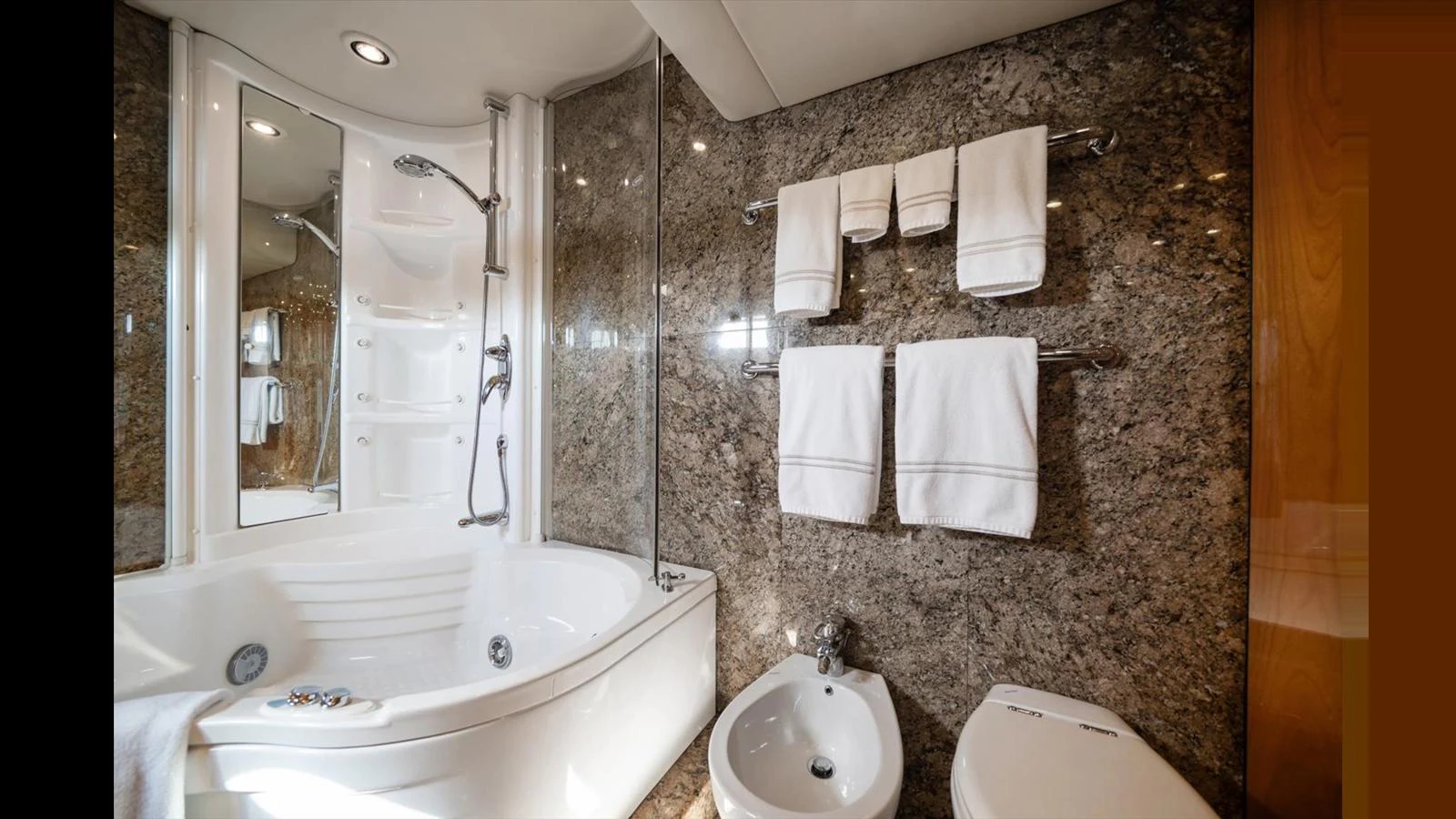 The yacht's bathroom features elegant marble walls and modern fixtures. aboard VANGUARD Yacht for Sale