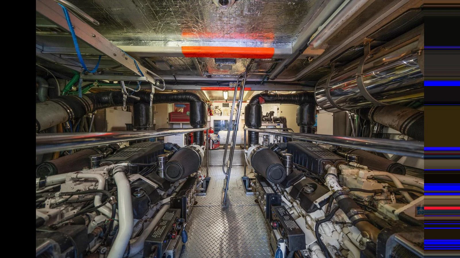 The image showcases the well-maintained engine room of the yacht, highlighting its powerful machinery. aboard VANGUARD Yacht for Sale