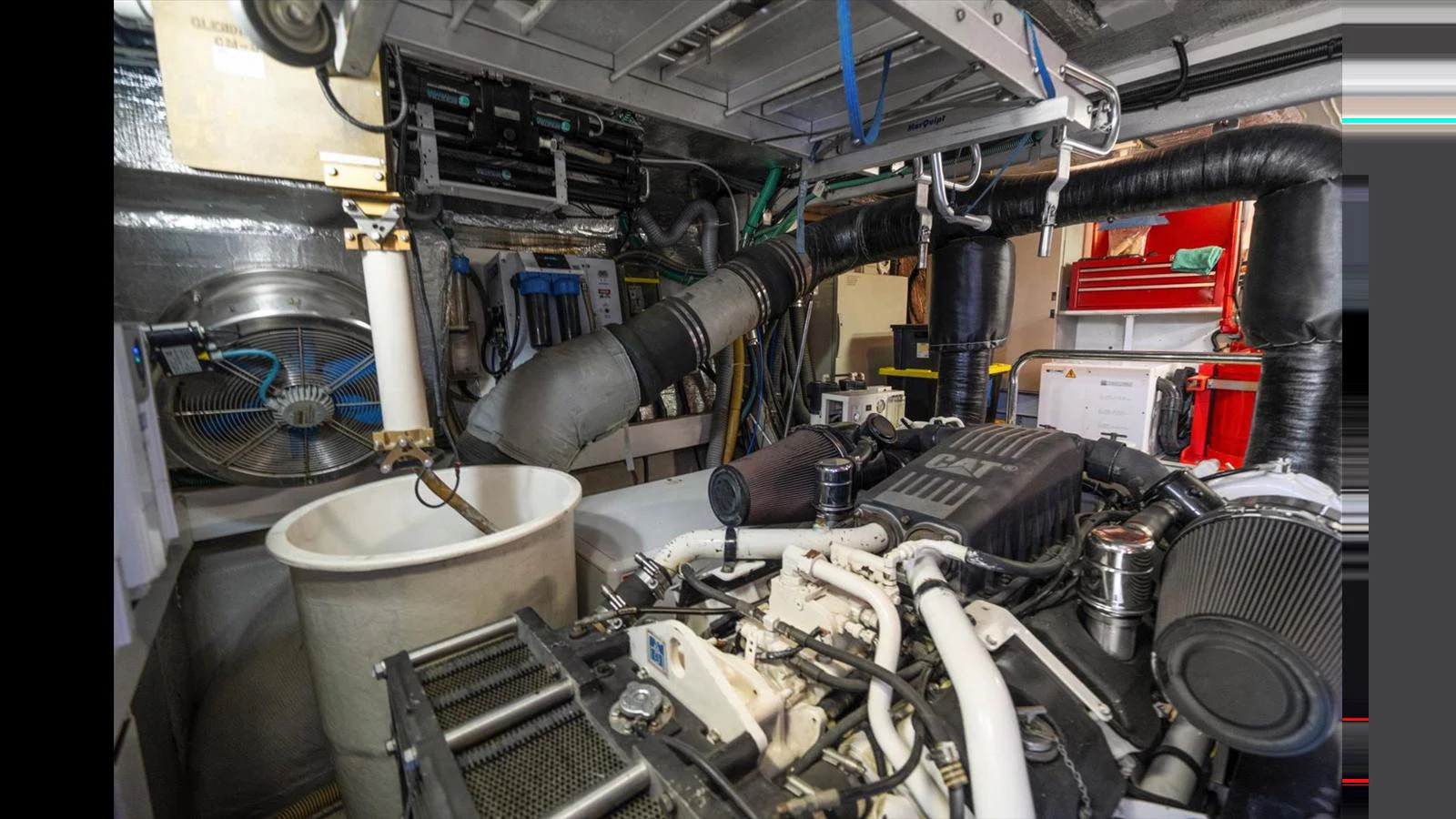 The image showcases the yacht's well-maintained engine room with various mechanical components and systems. aboard VANGUARD Yacht for Sale