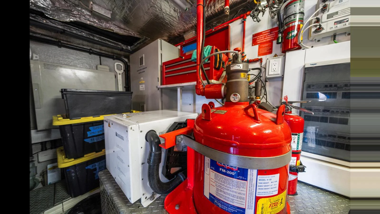 The image showcases the yacht's well-organized engine room with essential equipment and safety features. aboard VANGUARD Yacht for Sale
