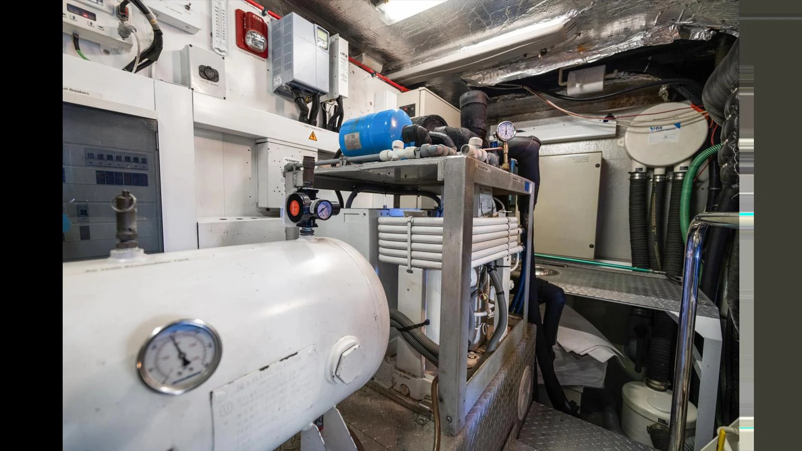 The image showcases the yacht's well-maintained engine room with various mechanical components and equipment. aboard VANGUARD Yacht for Sale
