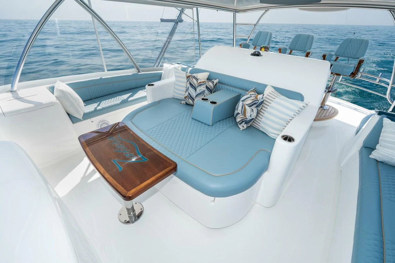 a white bed with a wooden frame aboard ZATARA Yacht for Sale