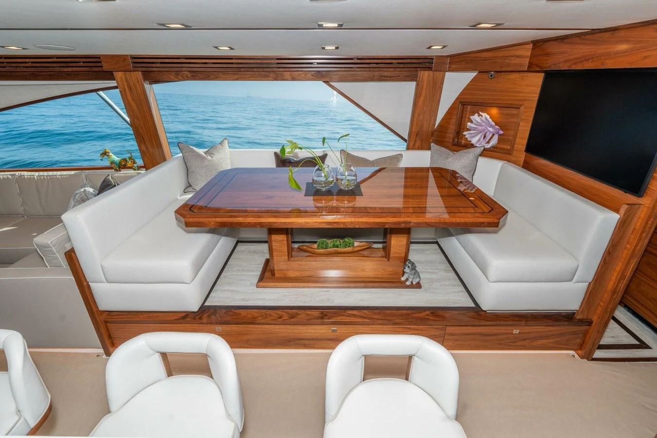 a room with a table and chairs aboard ZATARA Yacht for Sale