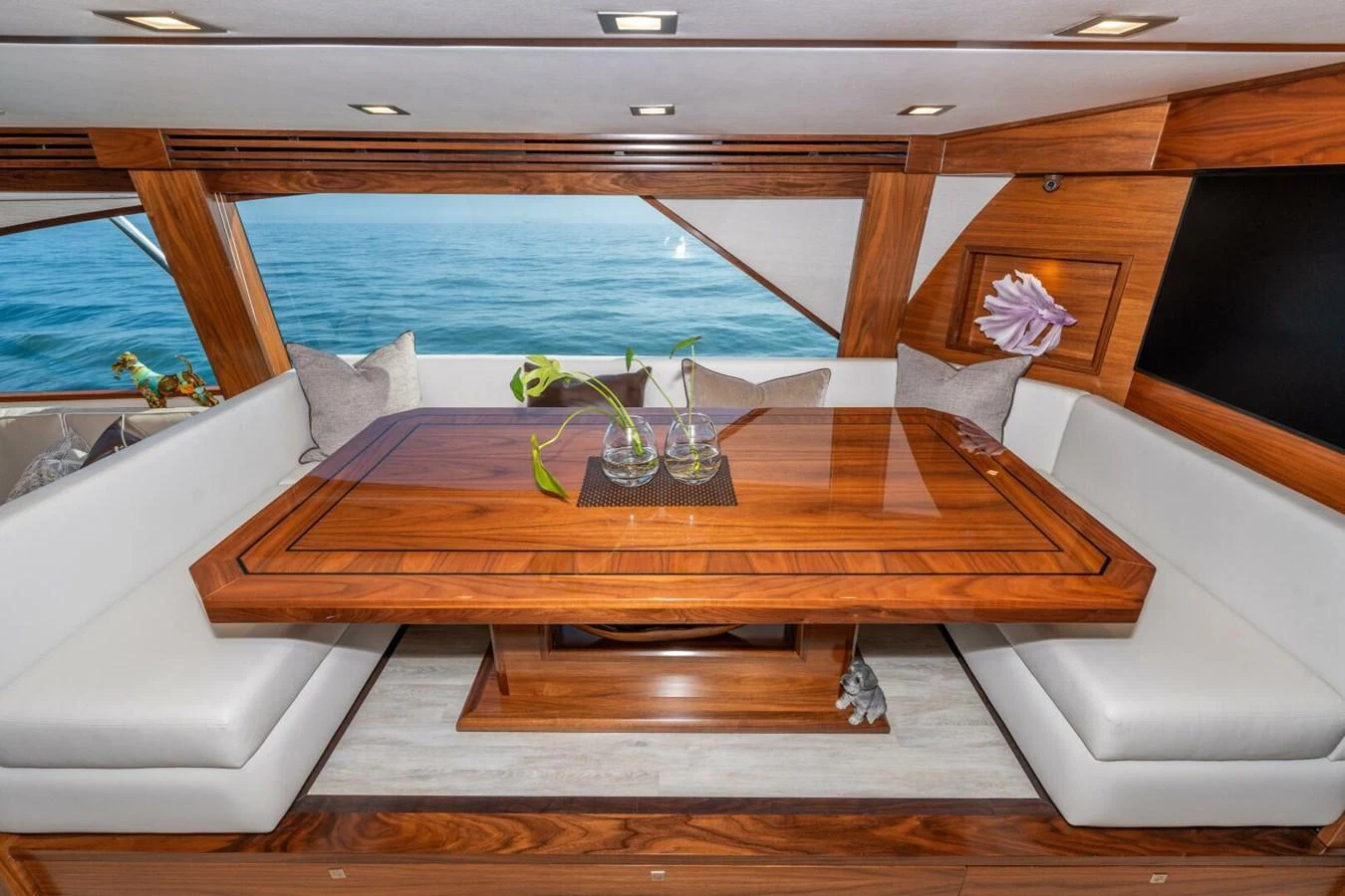 a table with chairs and a couch aboard ZATARA Yacht for Sale