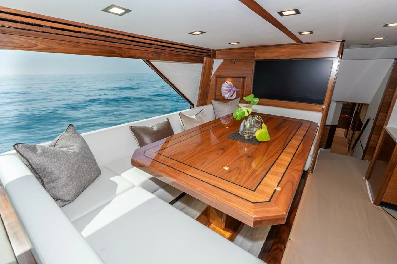 a room with a table and couches aboard ZATARA Yacht for Sale