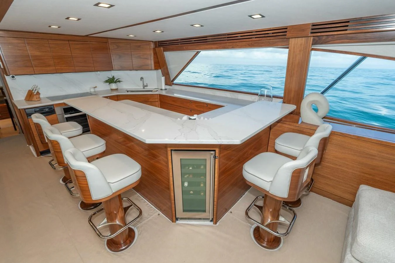a room with a large white bathtub and chairs aboard ZATARA Yacht for Sale