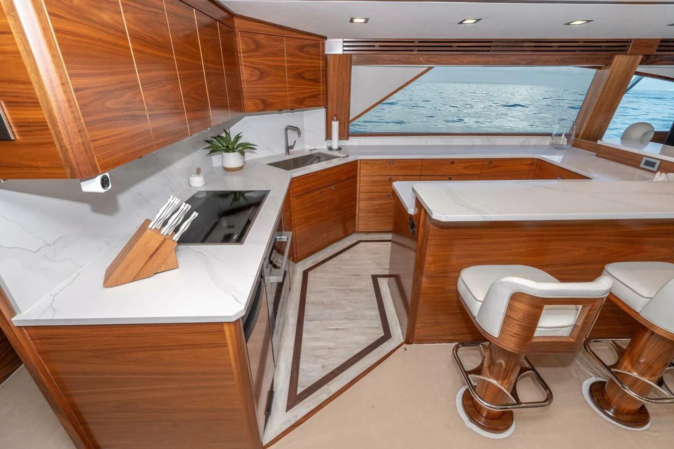a kitchen with wooden cabinets aboard ZATARA Yacht for Sale