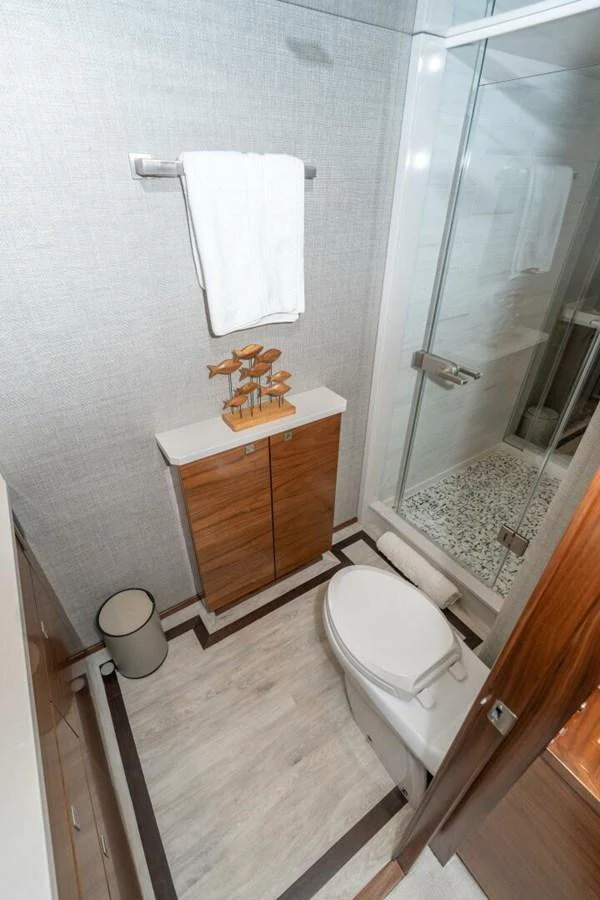 a bathroom with a toilet and a shower aboard ZATARA Yacht for Sale