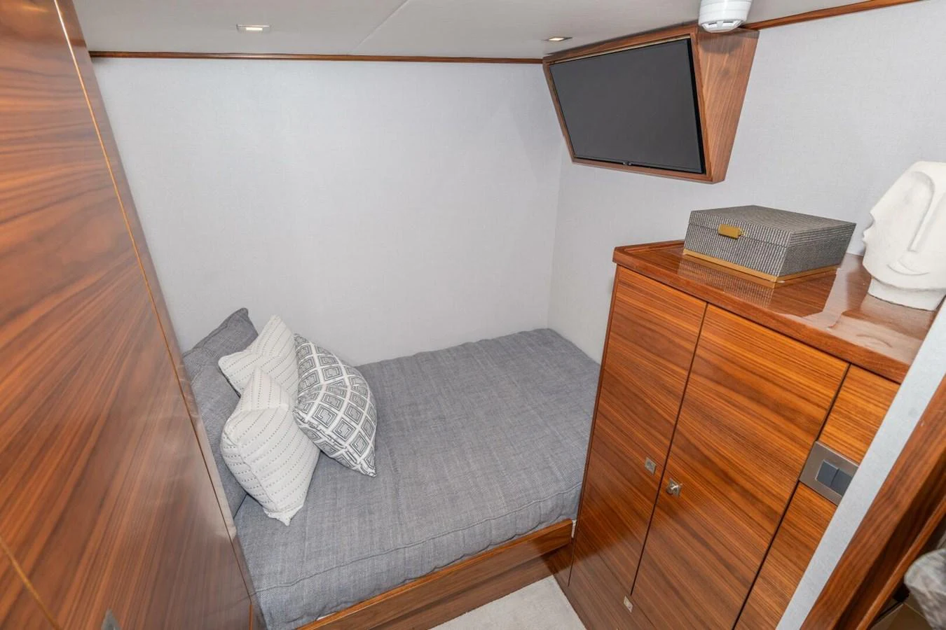 a room with a bed and a television aboard ZATARA Yacht for Sale