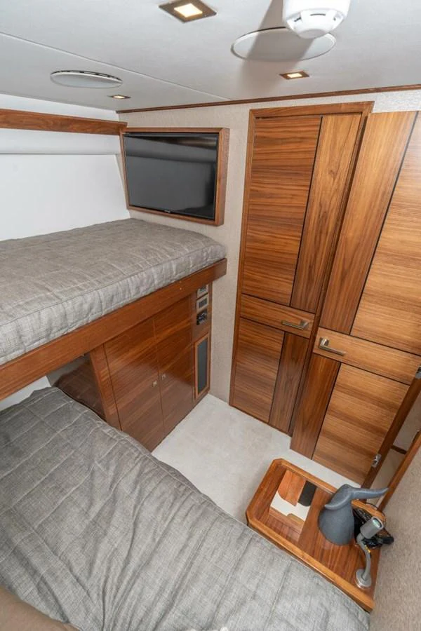 a bedroom with a bed and a television aboard ZATARA Yacht for Sale