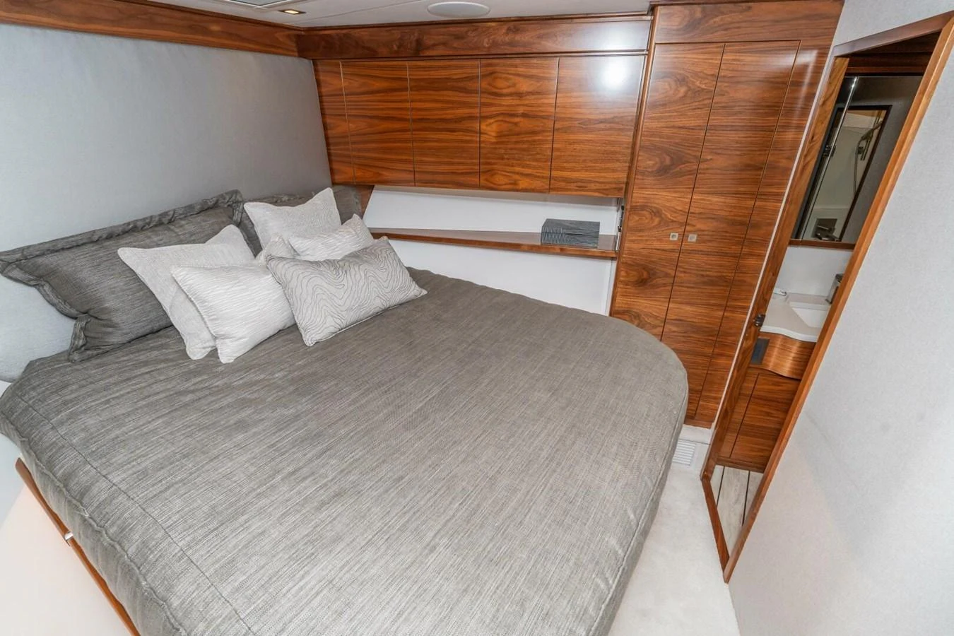 a bed with a white sheet aboard ZATARA Yacht for Sale