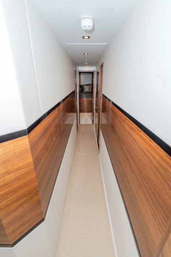 a long hallway with wooden floors aboard ZATARA Yacht for Sale
