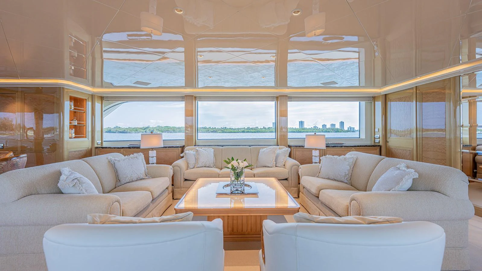The yacht's salon features plush seating and large windows offering panoramic views. aboard BETTY JANE Yacht for Sale