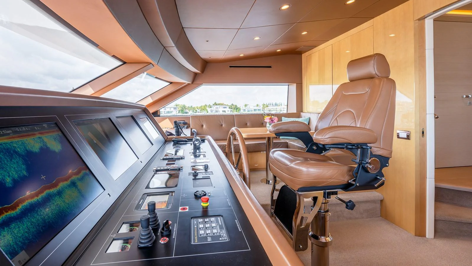 The helm station features advanced navigation equipment and a luxurious captain's chair. aboard BETTY JANE Yacht for Sale