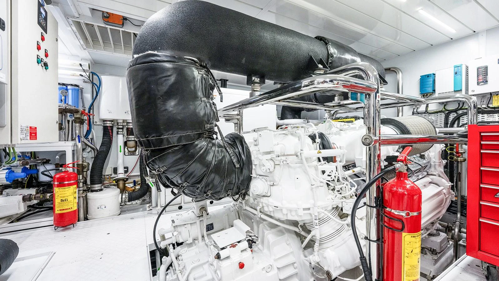 The yacht's engine room showcases advanced machinery and safety equipment. aboard BETTY JANE Yacht for Sale