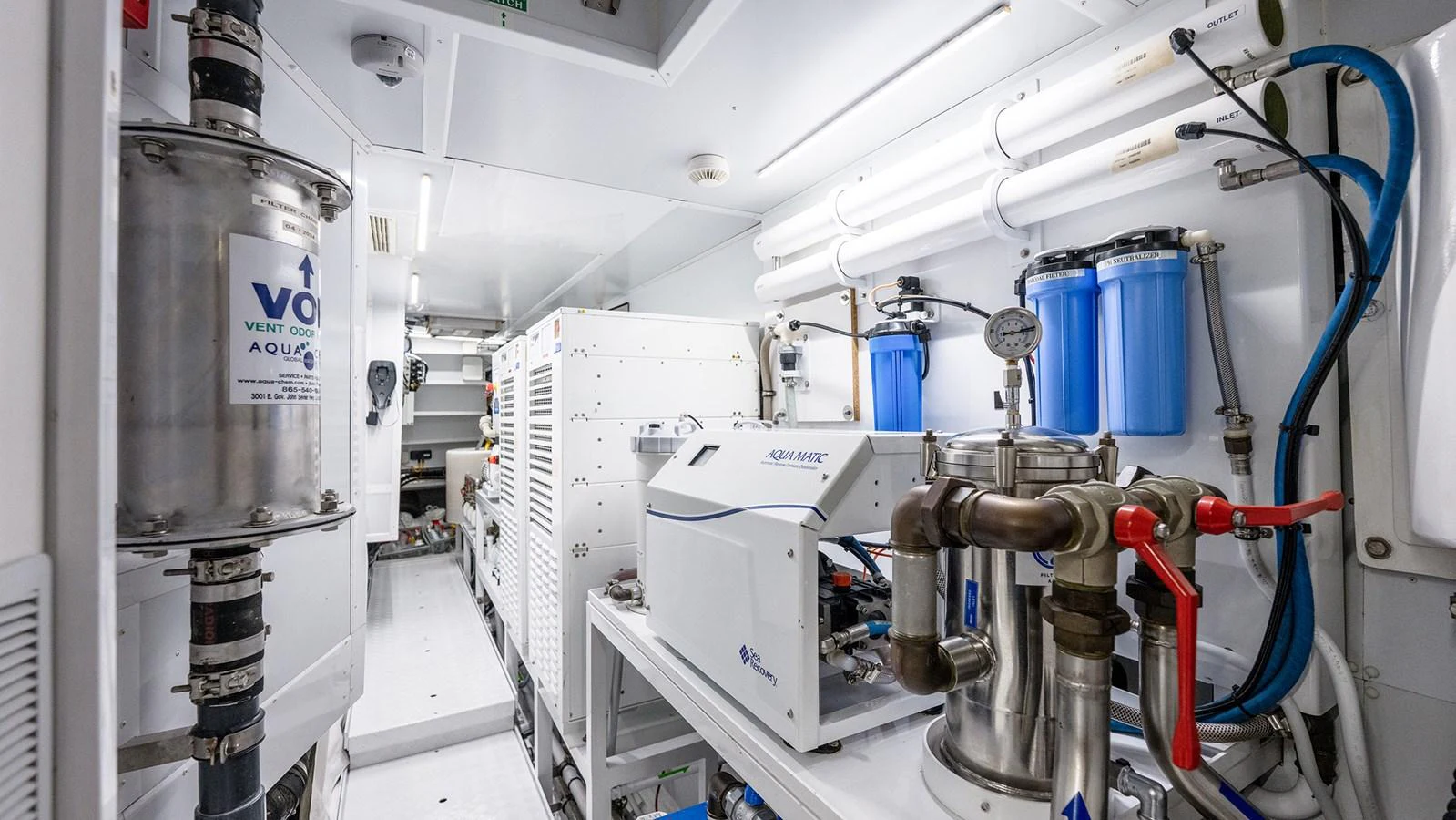 The engine room is equipped with advanced machinery and filtration systems, showcasing a well-maintained and organized space. aboard BETTY JANE Yacht for Sale