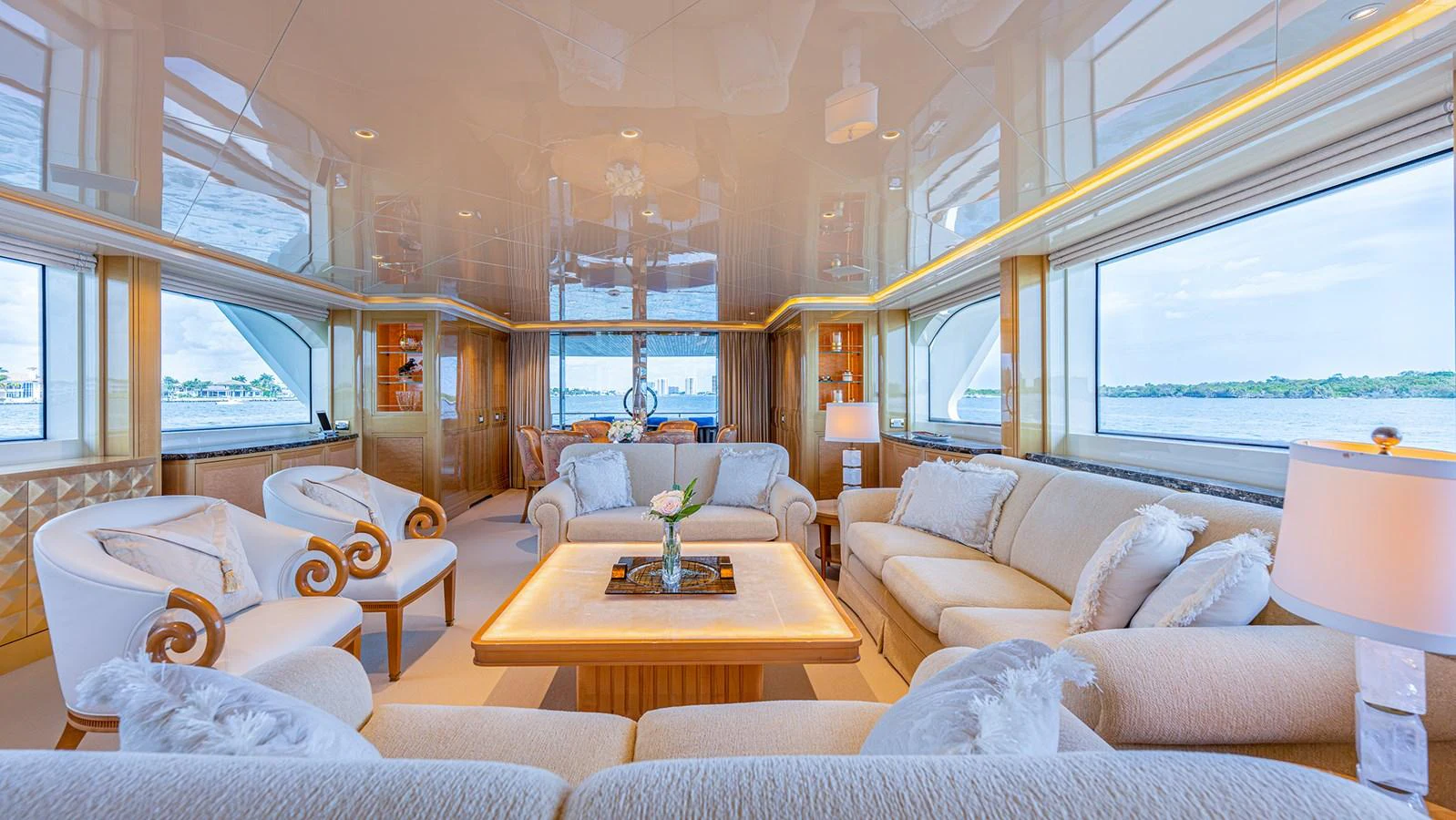 The salon features luxurious seating with panoramic windows offering stunning views. aboard BETTY JANE Yacht for Sale